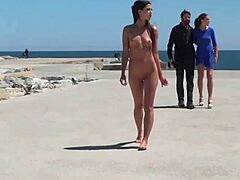 European beauty explores fetish for bondage and flashing on the beach