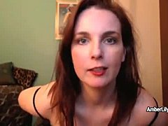 Brunette MILF Amber Lily shows off her masturbation skills in fishnets