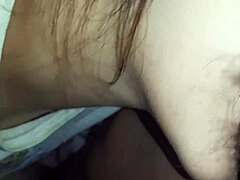 Filipina girlfriend gives a blowjob to her boyfriend in close-up