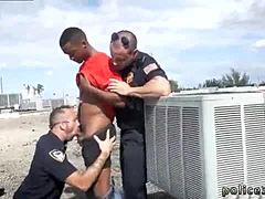 Gay porn video features interracial threesome with police men and sexy outdoor action